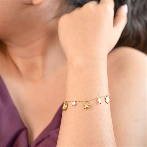 Amoura Dainty Gold Ocean Charms Bracelet | Mesmerize
