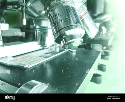 Microscope objective lenses and stage in macro Stock Photo - Alamy