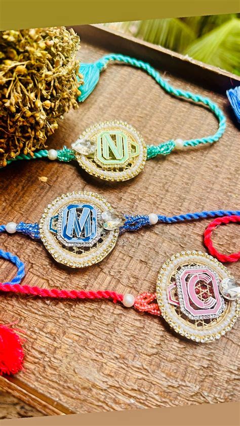 N-25 Super Stylish Initial Metal Alphabet Rakhi – Silver & Gold Poli ...