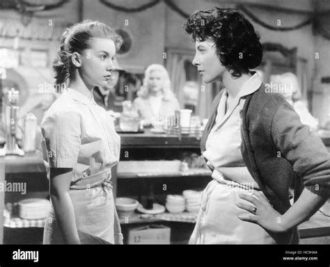 THE WAYWARD BUS, from left, Betty Lou Keim, Joan Collins, (background ...