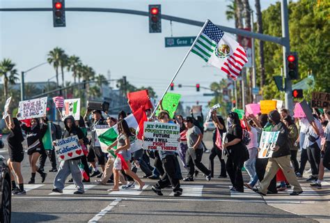 Protesters rally outside Angel Stadium against ICE sweeps in Anaheim ...