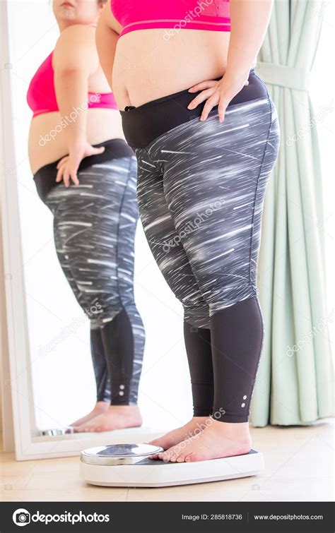 Fat asian girl weight measure — Stock Photo © ryanking999 #285818736