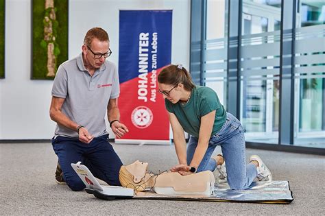 Emergency vehicles from the aid organization "Die Johanniter" pick up residents of a retirement home in Berlin, Germany, Saturday, Jan. 3, 2025, during a power cut in south-west Berlin after a fire on a cable bridge. (Michael Ukas/dpa via AP)