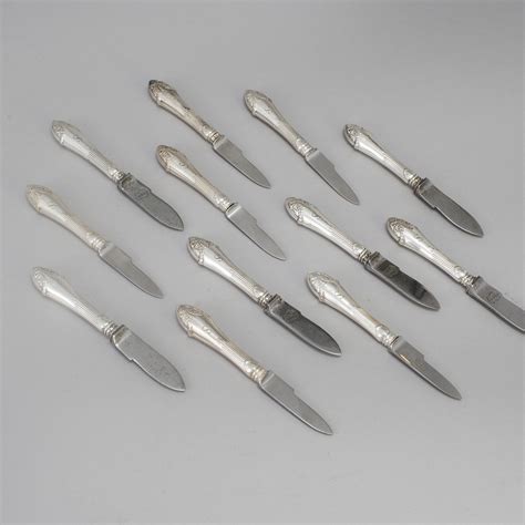 12 CRAYFISH KNIVES, silver plate, early 20th Century. Model 
