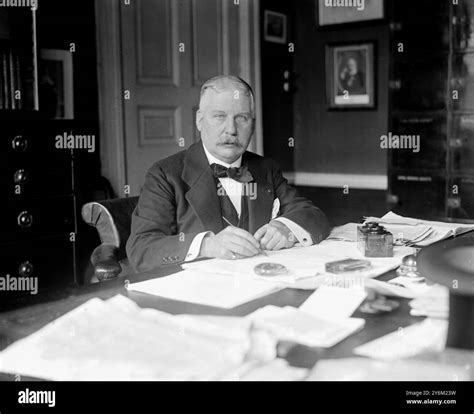 Sir William Dunn. Posing at a desk Stock Photo - Alamy