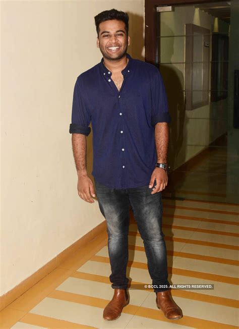 Kalabhavan Shajohn smiles for the camera during the audio launch ...