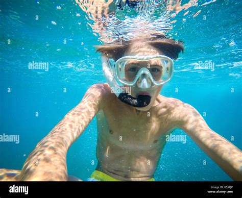 teenager having fun in the sea underwater - summertime - Sicily ...