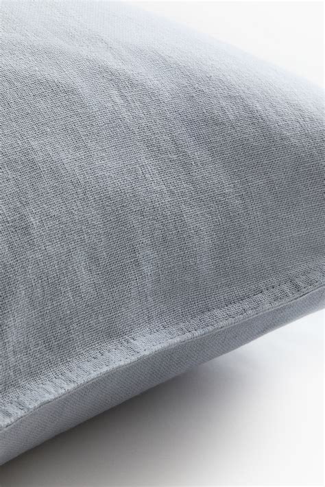 Linen-blend cushion cover - Light dusty blue - Home All | H&M IN