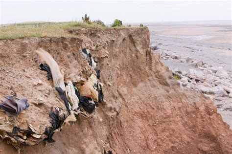 Toxic waste is spilling onto beaches as rising seas erode landfills ...