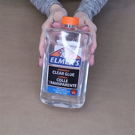 Woman fills glass vase with Elmer's glue for beautiful home decor hack ...
