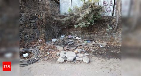 Garbage on footpath not swept for more than 6 mths - Times of India