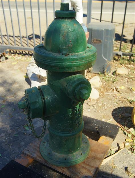 At Auction: Vintage Green Fire hydrant - Mueller
