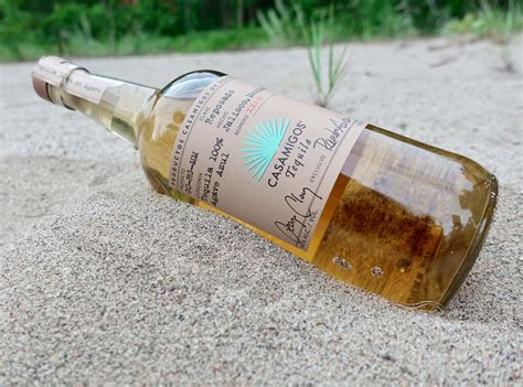 Download Casamigos Tequila Reposado Liquor Bottle On Sand Wallpaper ...