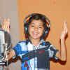 Child artist Azmat Hussain during a 'Qawwali' recording for a movie in ...