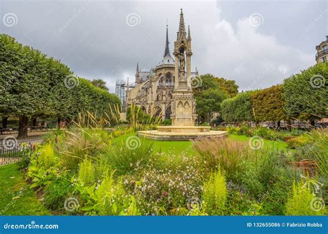 Apse of Notre-Dame De Paris and La Fontaine De La Vierge from Square Jean-XXIII. Paris, France ...