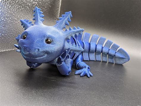 I was told y'all might appreciate my 3D printed axolotls, so here are ...