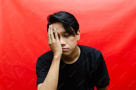 Premium Photo | Attractive asian male model with unhappy expression ...