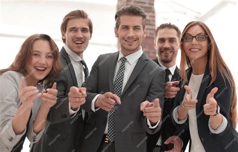 Group of People Standing in Office Pointing 的图像结果