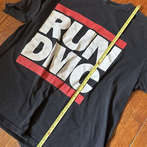Vintage Run-DMC shirt with classic logo. No tag,... - Depop