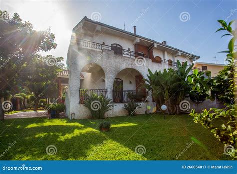 Typical Spanish-style Villa with Potted Plants Yucca and Banana Flames ...