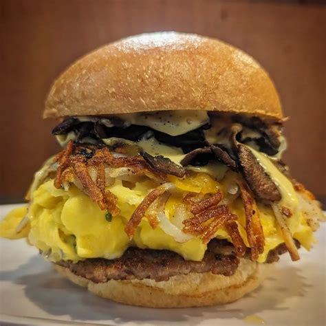 Scram Stack: scrambled eggs with chives, sausage smash patty, Tillamook ...