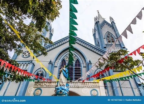 Blue Catholic Church Decorated with Flags and Saint Mary Statue Stock ...