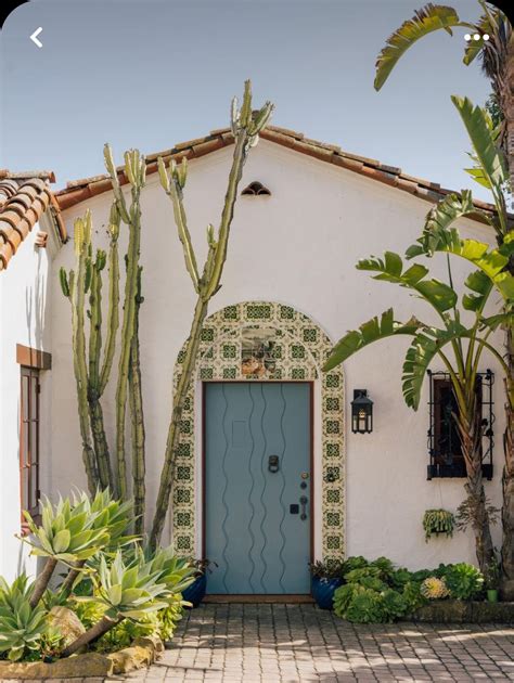 Spanish Revival Home with Blue Door