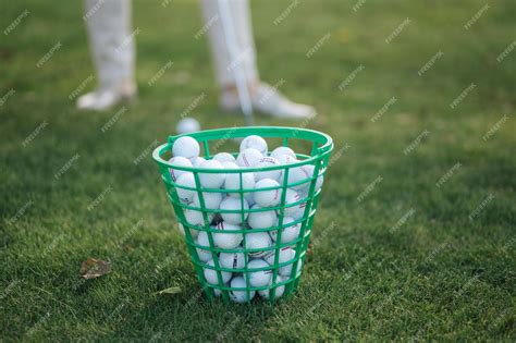 Premium Photo | Full golf ball bucket on golf field