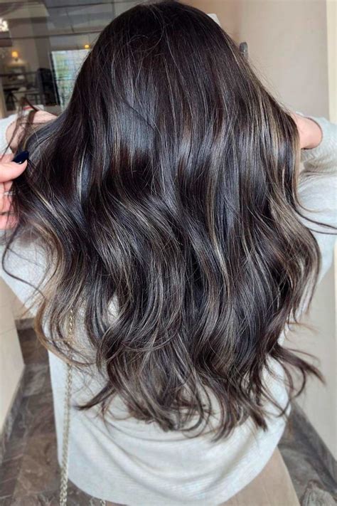dark brown hair with subtle ash highlights