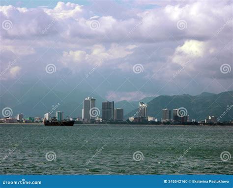 Photograph of Nha Trang beach with many high rise buildings behind it