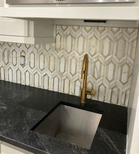Modern Kitchen with Gold and White Backsplash