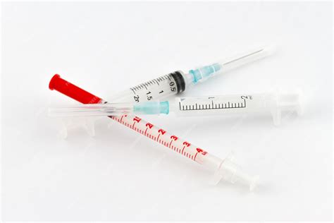 Premium Photo | Group of medical syringes with needles