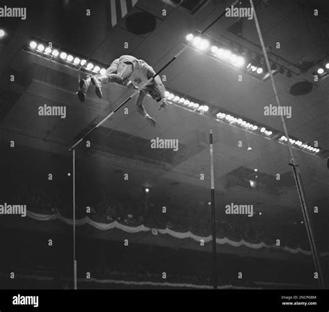John Uelses, German-born Marine, pole vaults 16 feet ¼ inch during the ...