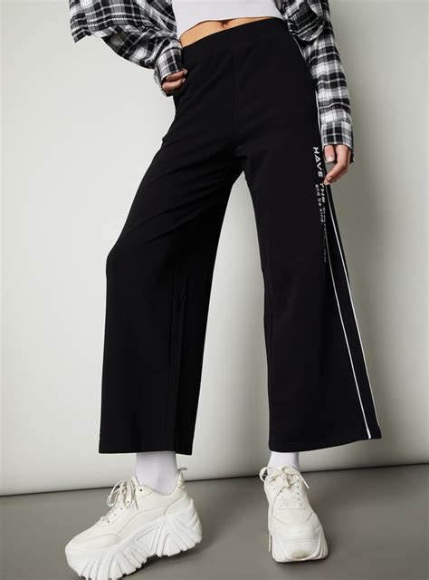 Buy Women Side Striped Wide Leg Trousers Online at just Rs. 999.0 ...
