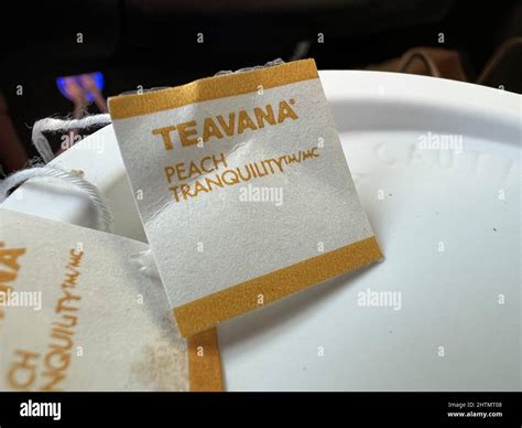 Close-up of label for Teavana Peach Tranquility atop a container of ...