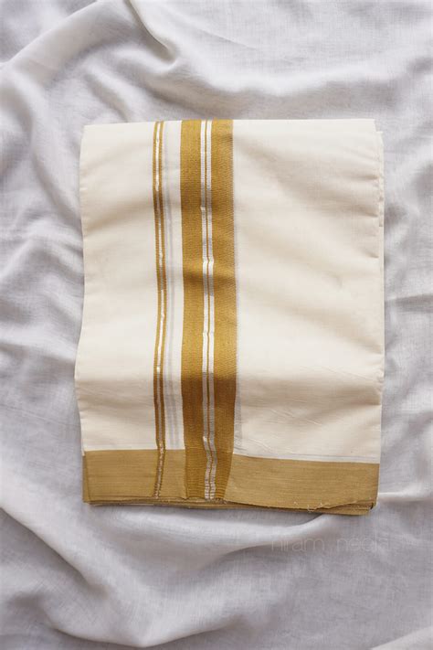 Ivory and mustard kasavu mundu | Niram Neela