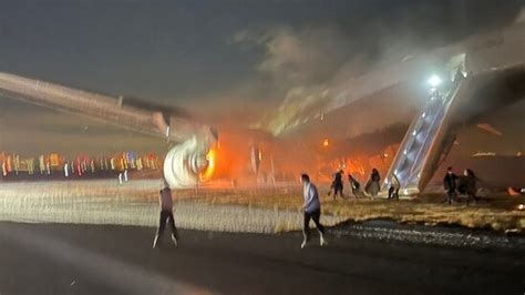 In pics: Plane in flames at Tokyo airport after colliding with aircraft ...
