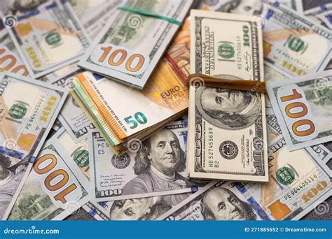 200 Euro Banknote Next To 50 Euros on Top of One Hundred Dollar Bills ...