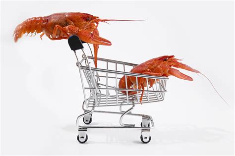 Premium Photo | Boiled red crayfish lobsters on a shopping basket funny ...
