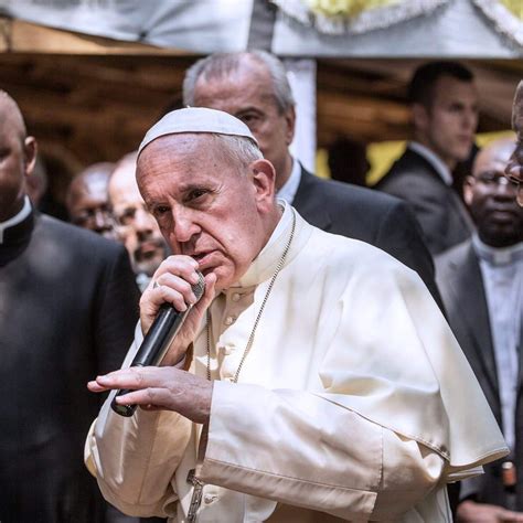 After the Pope takes off his all white winter coat, he starts droppen ...