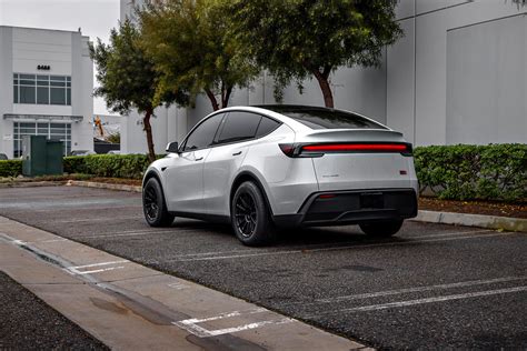 2026 Pearl White Model Y Juniper on 18 inch Off-Road Spec UP-03 in Satin Black