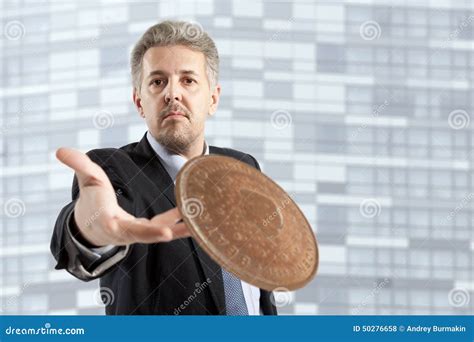 Businessman throws a coin stock photo. Image of finger - 50276658