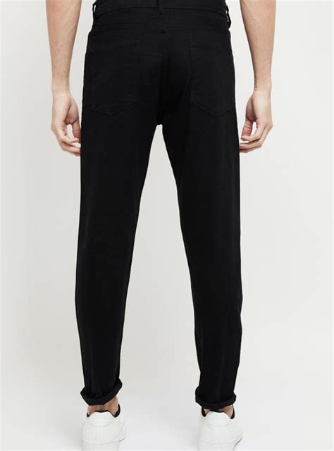 Buy Men Solid Carrot Fit Jeans Online at just Rs. 699.0 - 1000011495924 ...