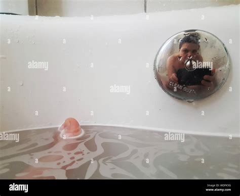 Woman taking selfie in bathroom one person hi-res stock photography and ...