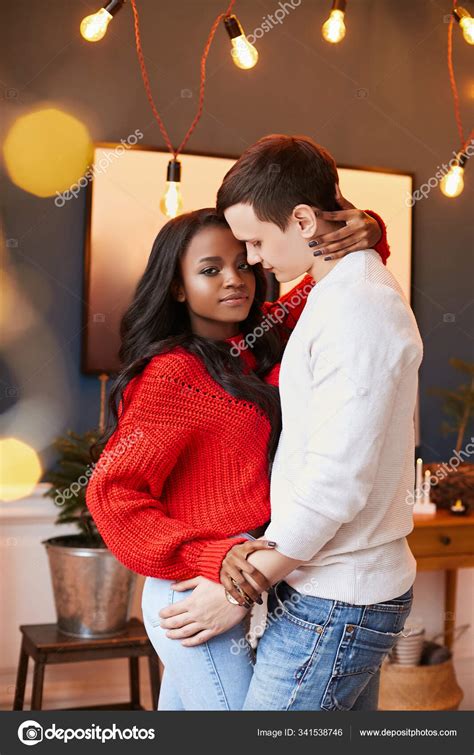 Young interracial couple in love on Valentine's day posing while ...