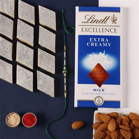 Send Sneh Fancy Green Rakhi with Lindt Chocolate Bar and Almonds and ...