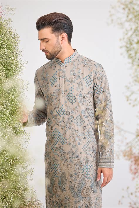 This Nude Coloured Long Kurta showcases magnificent Detailed Flora and ...