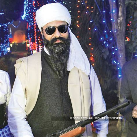 A guest dressed as Osama during the Orthodox Christmas Ball, held at ...