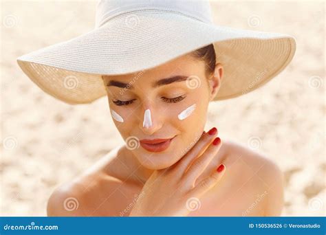 Suncream. Suntan Lotion Beautiful Woman Applying on Beautiful on Face. Sunscreen Solar Cream ...