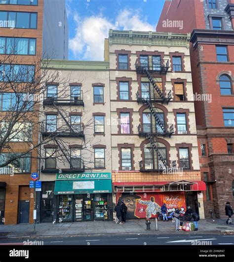 Stores and apartments along East 125th Street in East Harlem, New York City Stock Photo - Alamy